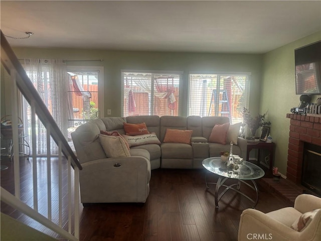116 Evergreen Pl, Perris, CA 92571 - living room featuring dark wood-style flooring and a fireplace