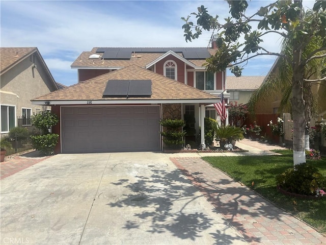 116 Evergreen Pl, Perris, CA 92571 - traditional home with roof mounted solar panels, driveway, roof with shingles, and a garage