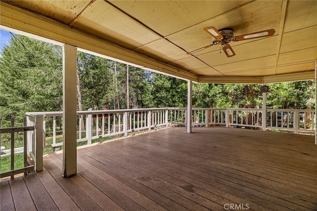 5048 Big Bend Rd, Oroville, CA 95965 - wooden terrace with ceiling fan and view of wooded area