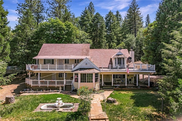 5048 Big Bend Rd, Oroville, CA 95965 - back of house with a lawn, a balcony, a deck, and a chimney