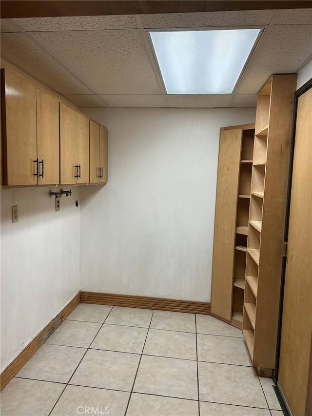 2035 N Spruce Ave, Rialto, CA 92377 - laundry room featuring baseboards and light tile patterned floors