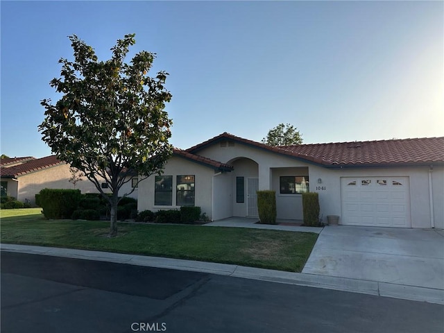 1061 Mountain View Dr, Hemet, CA 92545 - view of front of property featuring a tiled roof, a garage, stucco siding, and a front lawn