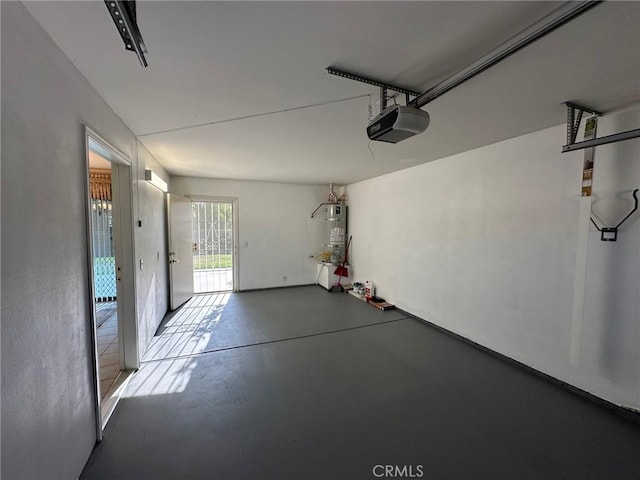 1061 Mountain View Dr, Hemet, CA 92545 - garage with a garage door opener and secured water heater