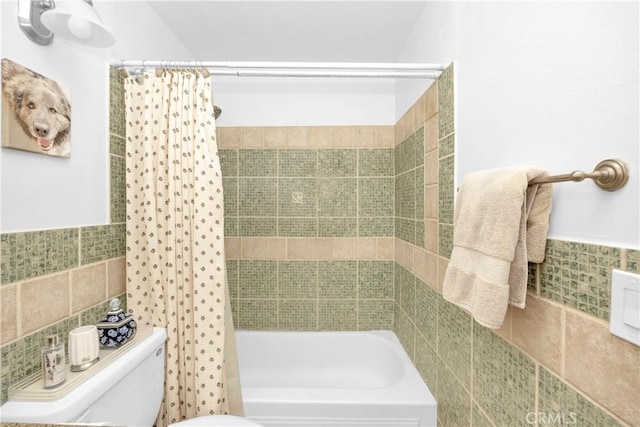 8381 E Hendrie St, Long Beach, CA 90808 - bathroom with tile walls, toilet, shower / tub combo, and wainscoting