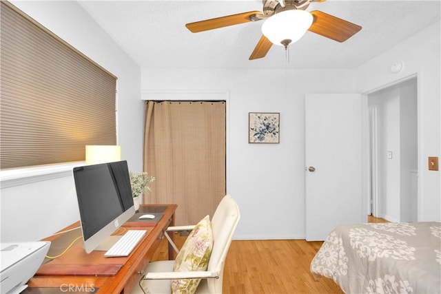 8381 E Hendrie St, Long Beach, CA 90808 - bedroom featuring light wood-style floors, a desk, and a ceiling fan