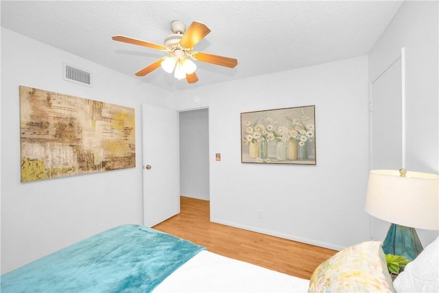8381 E Hendrie St, Long Beach, CA 90808 - bedroom with wood finished floors, a ceiling fan, and baseboards