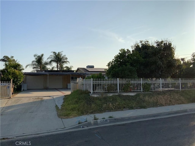 12536 Fineview St, El Monte, CA 91732 - view of front of property featuring a fenced front yard, an attached carport, and concrete driveway