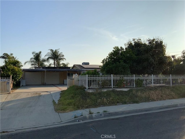 12536 Fineview St, El Monte, CA 91732 - view of front of house featuring a fenced front yard, an attached carport, and concrete driveway
