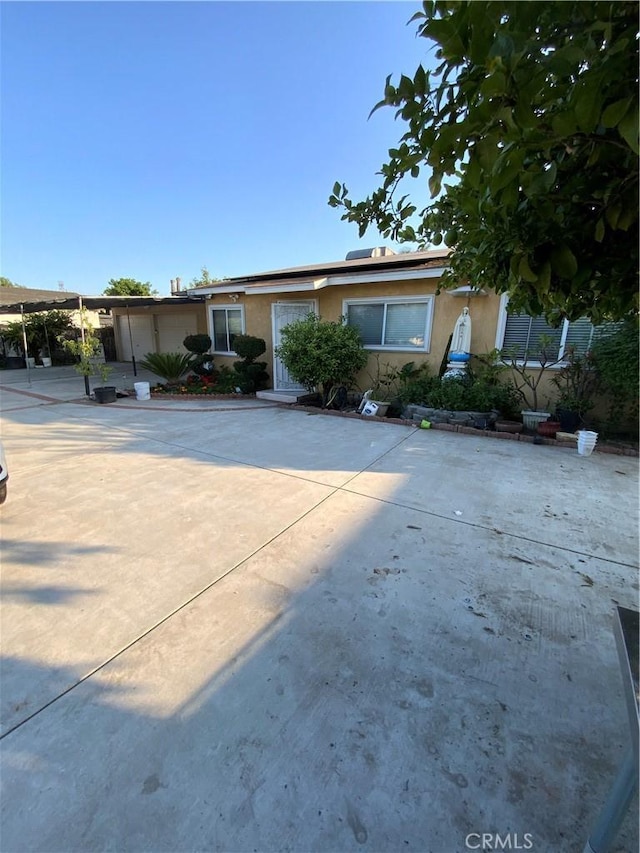 12536 Fineview St, El Monte, CA 91732 - view of front of home featuring stucco siding and solar panels
