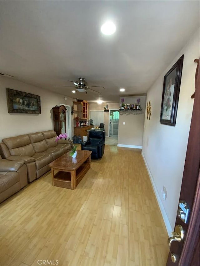 12536 Fineview St, El Monte, CA 91732 - living room with a ceiling fan and light wood-style flooring