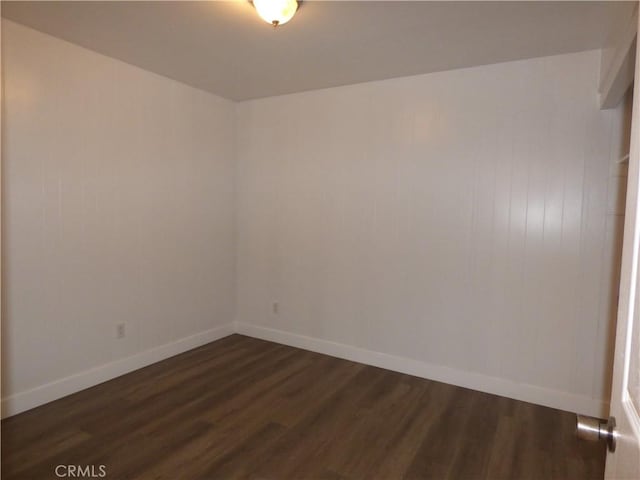 38565 Malby Ave, Palmdale, CA 93550 - unfurnished room with dark wood-style floors and baseboards
