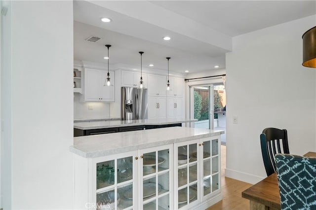 28332 Via Alfonse, Laguna Niguel, CA 92677 - kitchen featuring stainless steel fridge, recessed lighting, light wood-type flooring, glass insert cabinets, and white cabinets