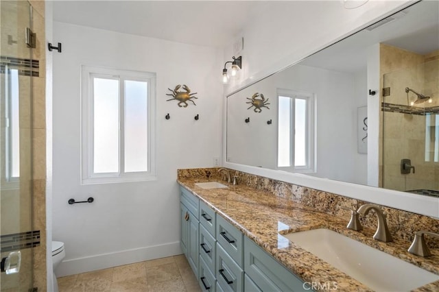 28332 Via Alfonse, Laguna Niguel, CA 92677 - full bath with double vanity, a shower stall, toilet, and baseboards