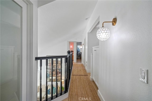 28332 Via Alfonse, Laguna Niguel, CA 92677 - hall featuring baseboards, an upstairs landing, and vaulted ceiling