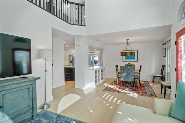 28332 Via Alfonse, Laguna Niguel, CA 92677 - living area with a towering ceiling and light wood-style floors