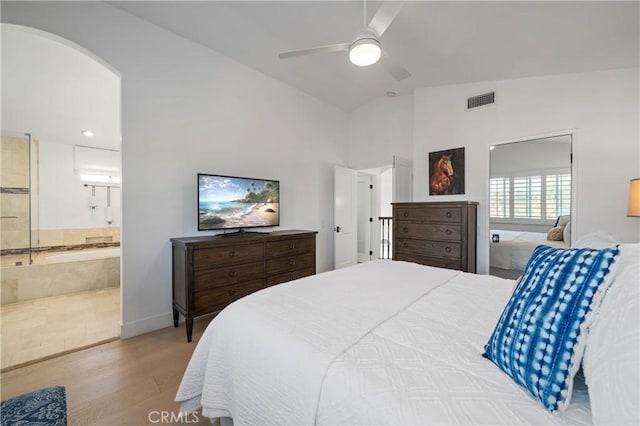 28332 Via Alfonse, Laguna Niguel, CA 92677 - bedroom featuring lofted ceiling, wood finished floors, arched walkways, ensuite bath, and a ceiling fan