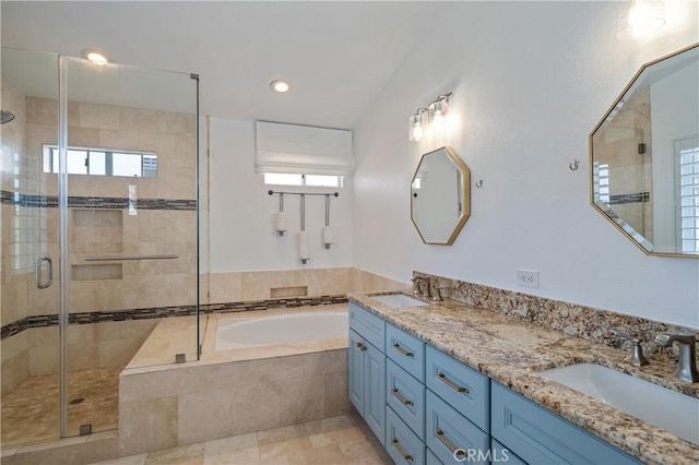 28332 Via Alfonse, Laguna Niguel, CA 92677 - bathroom featuring a bath, a stall shower, double vanity, healthy amount of natural light, and recessed lighting