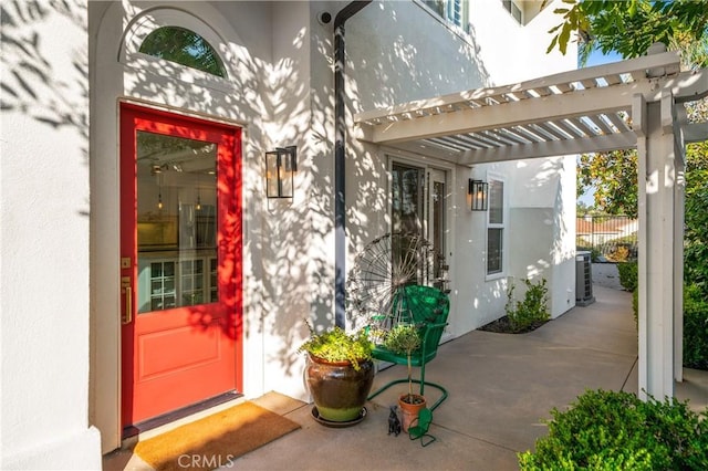 28332 Via Alfonse, Laguna Niguel, CA 92677 - doorway to property with stucco siding and a pergola