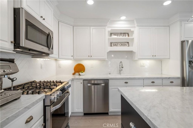 28332 Via Alfonse, Laguna Niguel, CA 92677 - kitchen featuring stainless steel appliances, a sink, white cabinets, light stone counters, and recessed lighting