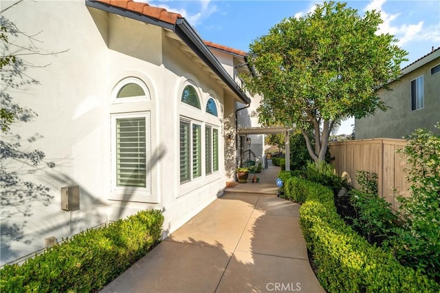 28332 Via Alfonse, Laguna Niguel, CA 92677 - view of property exterior featuring a patio, stucco siding, and a tile roof