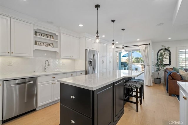 28332 Via Alfonse, Laguna Niguel, CA 92677 - kitchen with appliances with stainless steel finishes, a sink, white cabinets, tasteful backsplash, and recessed lighting