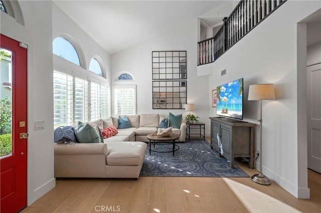 28332 Via Alfonse, Laguna Niguel, CA 92677 - living room with high vaulted ceiling, wood finished floors, and healthy amount of natural light
