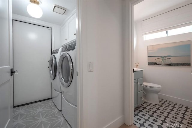 28332 Via Alfonse, Laguna Niguel, CA 92677 - washroom with independent washer and dryer, cabinet space, and light tile patterned floors