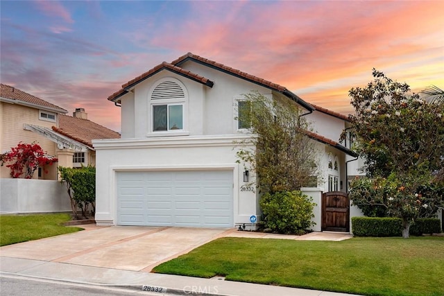 28332 Via Alfonse, Laguna Niguel, CA 92677 - mediterranean / spanish-style house featuring a garage, a tiled roof, driveway, stucco siding, and a gate