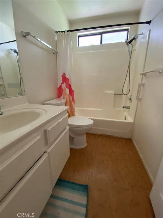 43321 Cottage Ln, Lancaster, CA 93536 - full bathroom featuring shower / bath combo with shower curtain, vanity, and toilet