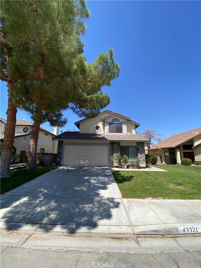 43321 Cottage Ln, Lancaster, CA 93536 - view of front of property with stone siding, a front yard, concrete driveway, and stucco siding