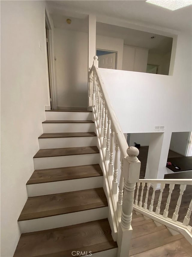 43321 Cottage Ln, Lancaster, CA 93536 - staircase with wood finished floors