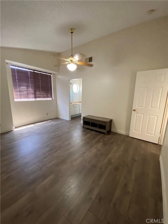 43321 Cottage Ln, Lancaster, CA 93536 - empty room with dark wood-type flooring, ceiling fan, baseboards, and lofted ceiling
