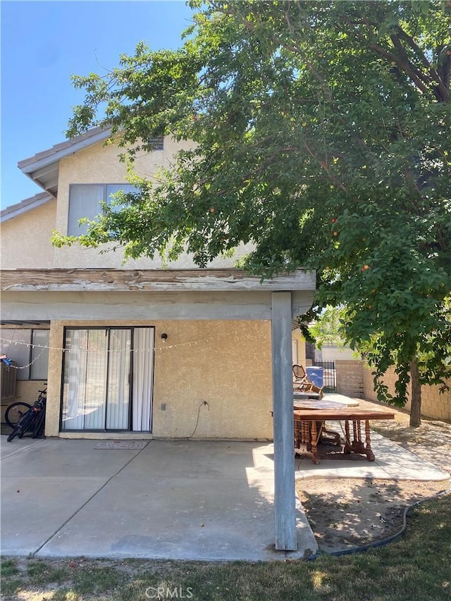 43321 Cottage Ln, Lancaster, CA 93536 - rear view of property featuring a patio area and stucco siding