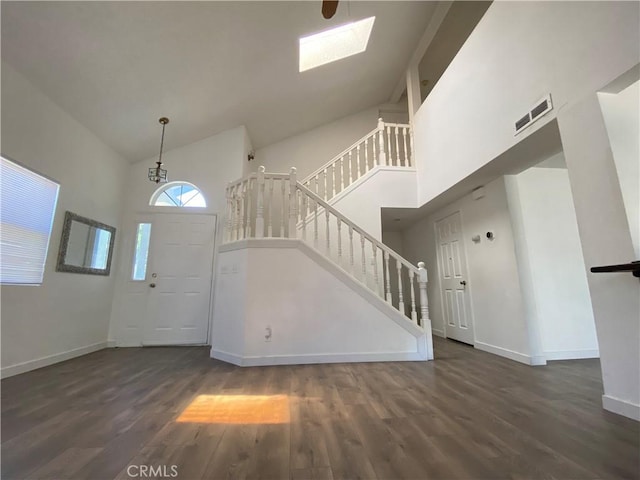 43321 Cottage Ln, Lancaster, CA 93536 - foyer entrance with high vaulted ceiling, stairs, wood finished floors, and a skylight