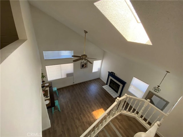 43321 Cottage Ln, Lancaster, CA 93536 - living area featuring wood finished floors, a fireplace, high vaulted ceiling, and ceiling fan
