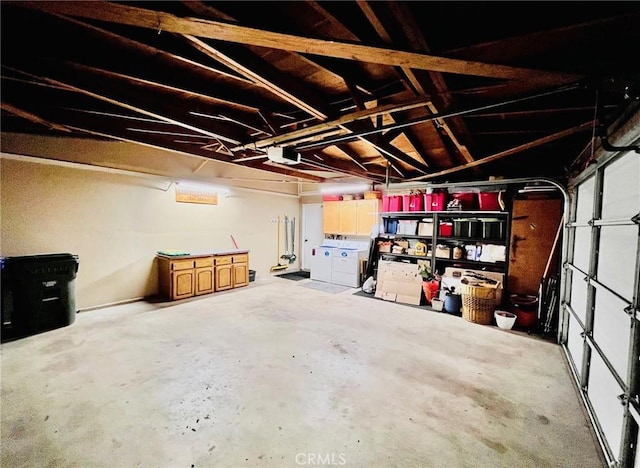 21161 Rancherias Rd, Apple Valley, CA 92307 - garage with washing machine and dryer and a garage door opener