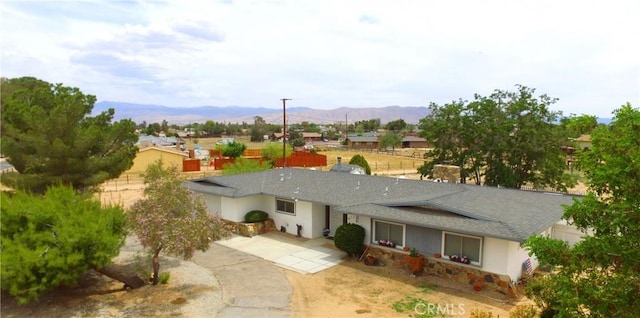 21161 Rancherias Rd, Apple Valley, CA 92307 - rear view of property with a mountain view and a shingled roof