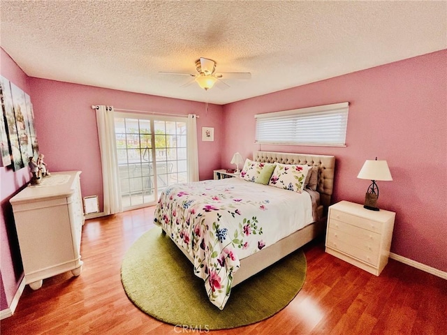 21161 Rancherias Rd, Apple Valley, CA 92307 - bedroom featuring wood finished floors, baseboards, a ceiling fan, and a textured ceiling
