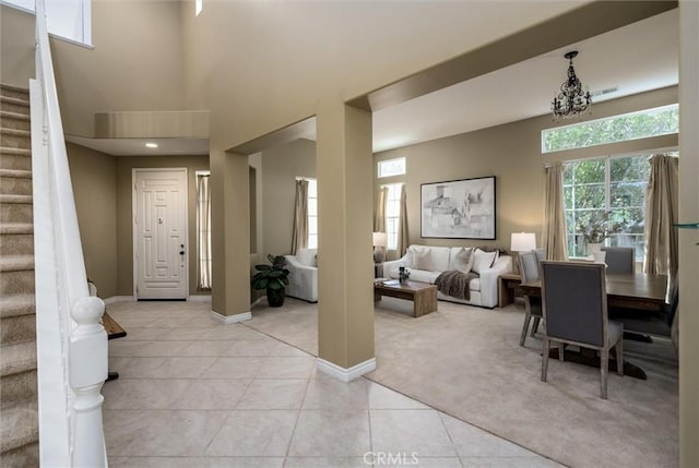 44035 Cindy Cir, Temecula, CA 92592 - foyer entrance with stairway, light colored carpet, light tile patterned floors, and a towering ceiling