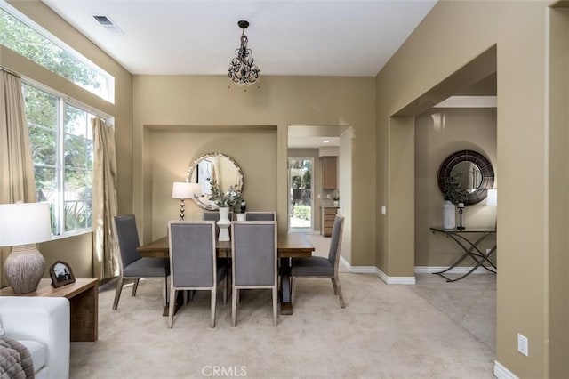 44035 Cindy Cir, Temecula, CA 92592 - dining area featuring healthy amount of natural light, light carpet, and a chandelier