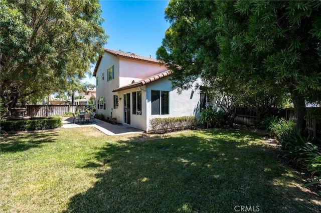 44035 Cindy Cir, Temecula, CA 92592 - rear view of house featuring a patio area, a fenced backyard, stucco siding, and a tiled roof