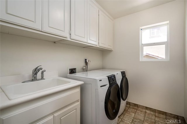 44035 Cindy Cir, Temecula, CA 92592 - laundry area with cabinet space, light stone finish flooring, and washer and clothes dryer