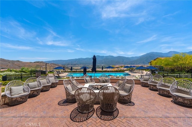 11986 Sagecrest Ct, Corona, CA 92883 - view of patio / terrace featuring a mountain view and a community pool