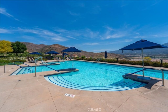 11986 Sagecrest Ct, Corona, CA 92883 - community pool with a mountain view and a patio