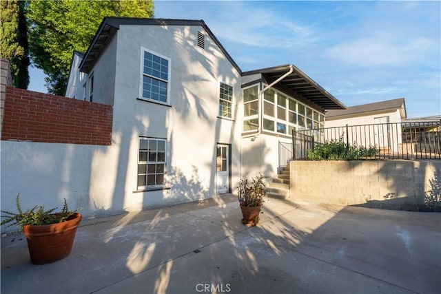 1748 Prince Albert Dr, Riverside, CA 92507 - view of front of house with stucco siding and a patio area