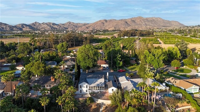 1748 Prince Albert Dr, Riverside, CA 92507 - aerial view of property and surrounding area with a mountain backdrop and nearby suburban area