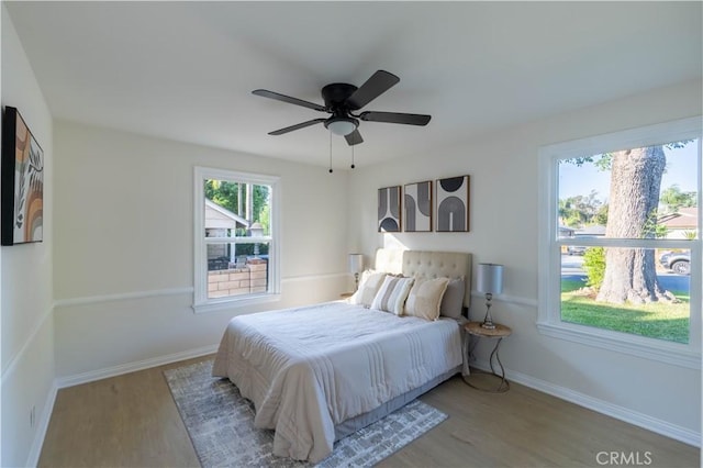 1748 Prince Albert Dr, Riverside, CA 92507 - bedroom featuring wood finished floors, baseboards, and a ceiling fan