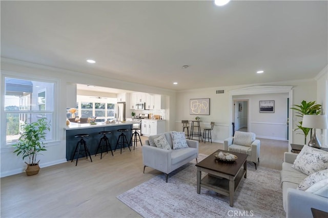 1748 Prince Albert Dr, Riverside, CA 92507 - living room with ornamental molding, light wood-type flooring, baseboards, and recessed lighting