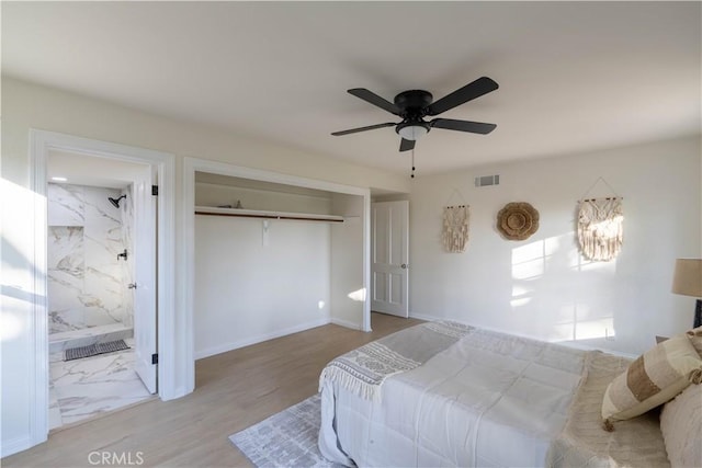 1748 Prince Albert Dr, Riverside, CA 92507 - bedroom featuring wood finished floors, a closet, connected bathroom, a ceiling fan, and baseboards