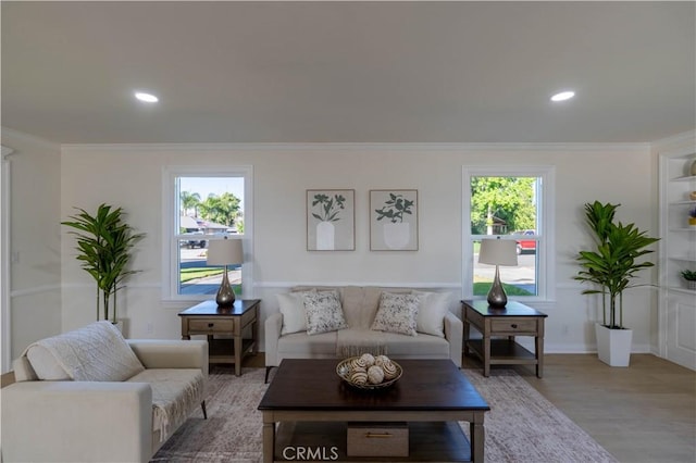 1748 Prince Albert Dr, Riverside, CA 92507 - living room featuring healthy amount of natural light, light wood finished floors, ornamental molding, recessed lighting, and baseboards